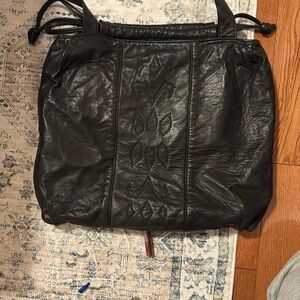 Vintage Black Leather Tote Bag with Drawstring Closure